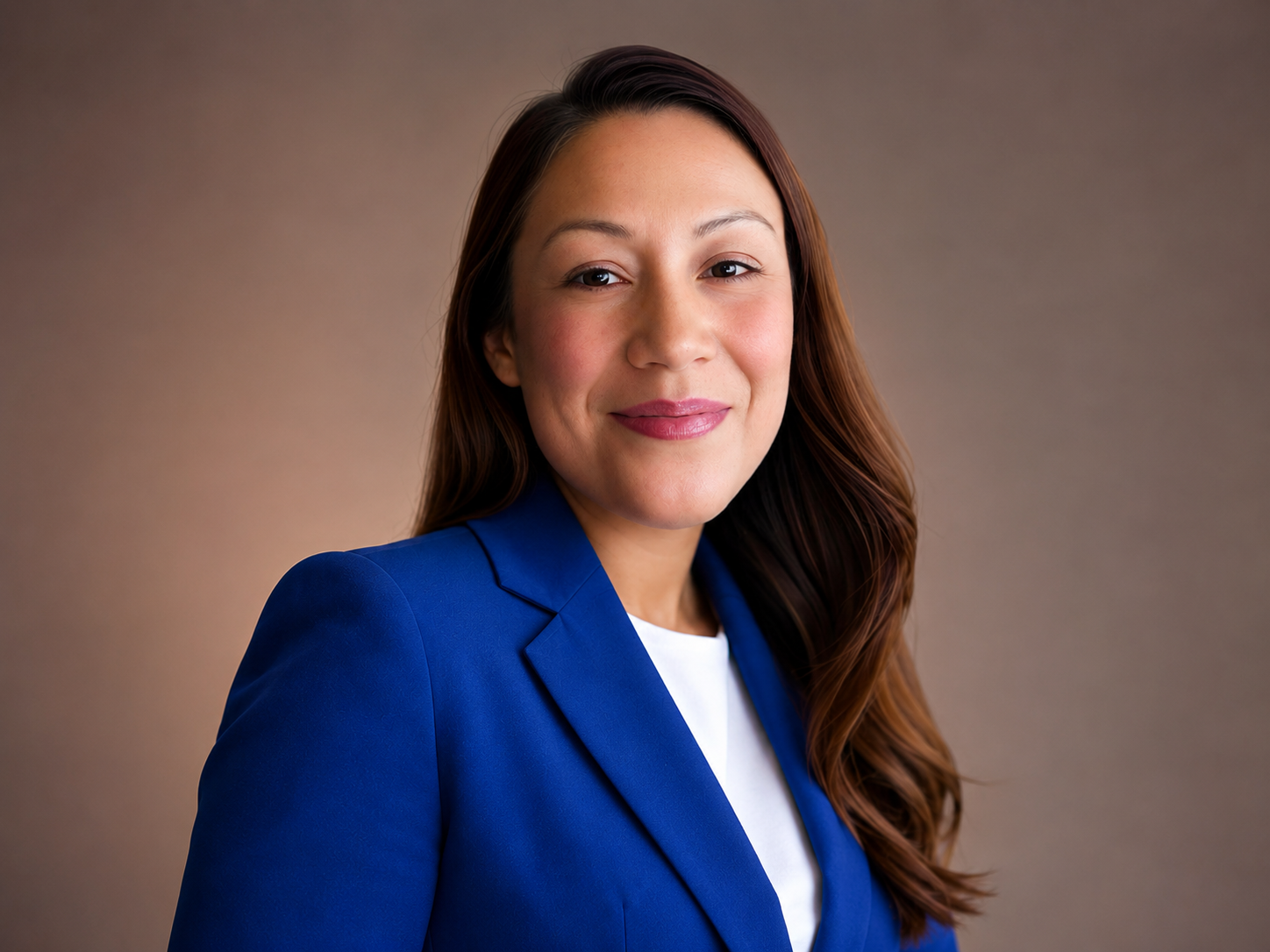 Maria, founder and owner of CreativeDNA, wearing a blue blazer